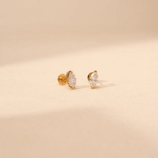 Angled view of marquise-cut lab-grown diamond stud earrings in 14 KT rose gold, featuring bezel-set marquise-cut solitaire diamonds with intricate open gallery detailing in a timeless elegant design.