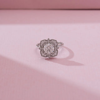 Top view of Vintage Square Halo Diamond Ring in white gold, featuring a round lab-grown diamond framed by an ornate square halo with intricate diamond detailing, placed on a soft pink backdrop.