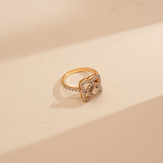 Side view of Reia’s 14 KT Yellow Gold Geometric Square Halo Diamond Ring. It highlights a central brilliant diamond framed by a multi-layered square halo and a pavé-set shimmering band.
