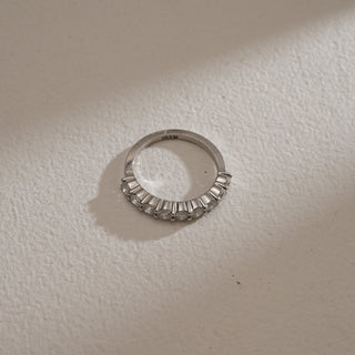 Top view of Minimalist 9-Stone Diamond Ring on beige background. Crafted in 14KT hallmarked white gold, size 12, featuring EF colour, VVS clarity lab grown diamonds totaling 1 carat across nine stones. Ring weighs 2.85 grams, priced INR 50,000–1,00,000.