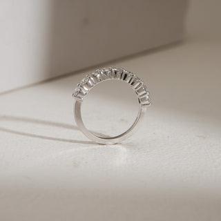 Side view of Minimalist 9-Stone Diamond Ring photographed on beige background. Made in 14KT hallmarked white gold, size 12, set with EF VVS lab grown diamonds totaling 1 carat. Ring weighs 2.85 grams and falls in the price range of INR 50,000–1,00,000.