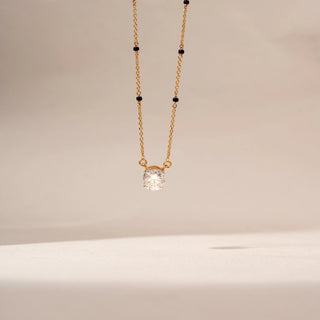 Front view of Solitaire Diamond Mangalsutra in 14KT Yellow Gold, featuring a round lab-grown diamond pendant with black beads.