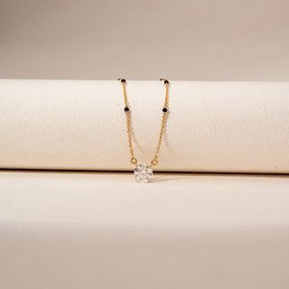 Close-up view of Solitaire Diamond Mangalsutra in 14KT Yellow Gold, featuring a round lab-grown diamond pendant and black beads.