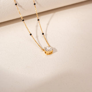 Top view of Solitaire Diamond Mangalsutra in 14KT Yellow Gold, featuring a round lab-grown diamond pendant and black beads.