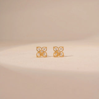 Front view of 14KT yellow gold floral diamond stud earrings, featuring four-petal motifs with round lab-grown diamonds.