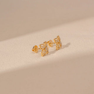 Side view of 14KT yellow gold floral diamond stud earrings, featuring four-petal motifs with round lab-grown diamonds.