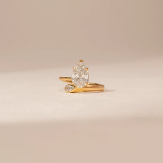 Front view of Elegant Pear Twist Diamond Ring in 14KT Yellow Gold, featuring a pear-cut lab-grown diamond.