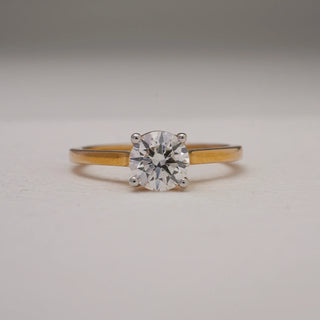 Close-up view of 14KT Yellow Gold Eternal Promise Solitaire Diamond Ring featuring a 1 CT EF VVS round diamond in a four-prong setting, symbolising timeless elegance and commitment.