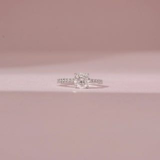 Front view of a 14KT White Gold diamond ring, featuring a cushion-cut centre diamond and diamond-set shoulders.