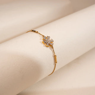 Top-down view of Reia’s 14 KT Yellow Gold Intricate Floral Mandala Diamond Ring. Captured on a cream backdrop, it highlights the architectural petals and sun-like rays set with brilliant diamonds.