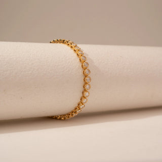 Side view of Delicate Graduated Diamond Tennis Bracelet in 14KT Dual Gold, featuring round-cut lab-grown diamonds.