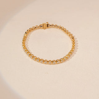 Top view of Delicate Graduated Diamond Tennis Bracelet in 14KT Dual Gold, featuring round-cut lab-grown diamonds.