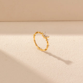 Angled view of Floral Vine Diamond Ring in 14KT Yellow Gold, featuring round and marquise lab-grown diamonds.
