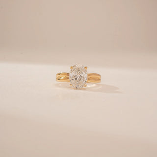 Front view of a 14KT Yellow Gold diamond ring, featuring an oval-cut centre diamond and a double-band design.