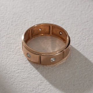 Top view of a men’s rose gold diamond ring in 14KT hallmarked gold, displaying evenly distributed EF VVS lab grown diamonds across the band. The matte-polished rose gold finish enhances the brilliance of the inset diamonds, creating a timeless, structured look.