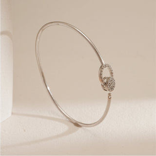 Sleek Circle Accent Diamond Bracelet in 14KT hallmarked white gold, shown from a side angle. Features two interlinked circular diamond motifs with EF colour, VVS clarity lab grown diamonds. The slender bangle design highlights minimal elegance and modern craftsmanship.