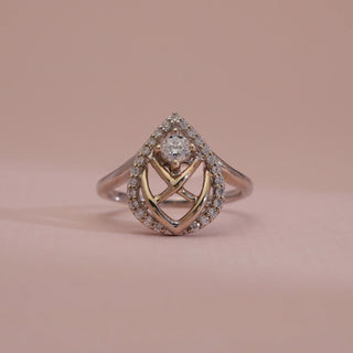 Close-up view of 14KT White Gold Classic Halo Teardrop Diamond Ring with round EF VVS solitaire, pavé halo, and intricate lattice detailing, blending modern design with timeless elegance.