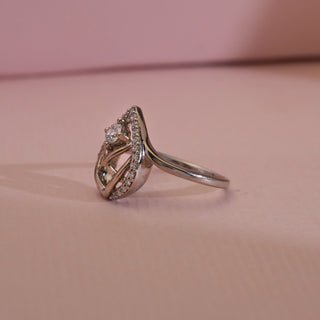 Side view of 14KT White Gold Classic Halo Teardrop Diamond Ring with EF VVS round solitaire, pavé halo, and open lattice detailing, showcasing elegant curves and intricate craftsmanship.