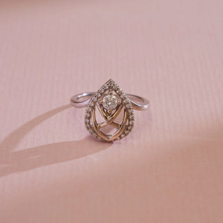 Top view of the 14KT White Gold Classic Halo Teardrop Diamond Ring featuring EF VVS round solitaire with pavé halo and intricate lattice detailing, crafted for elegance and everyday sparkle.