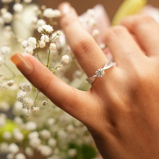 Solitaire ring featuring a round-cut center diamond set on a smooth tapered band, creating a timeless and elegant everyday design.
