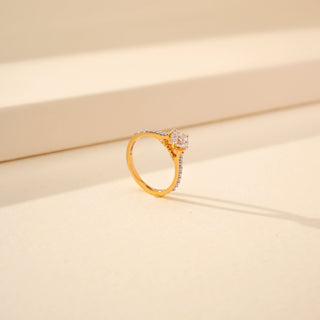 Angled view of Elegant Pave Shoulder Diamond Ring in 14KT Yellow Gold, featuring a round-cut lab-grown diamond.