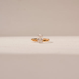 Front view of Oval Solitaire Diamond Ring in 14KT Yellow Gold, featuring a prominent lab-grown diamond in a prong setting.