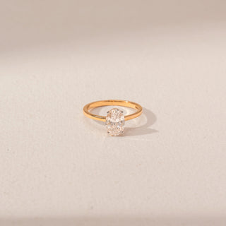 Top view of Oval Solitaire Diamond Ring in 14KT Yellow Gold, featuring a lab-grown diamond in a prong setting.