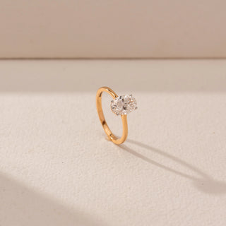 Angled view of Toi et Moi Diamond Ring in 14KT Yellow Gold, featuring two round lab-grown diamonds in a prong setting.