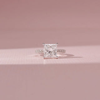 Front view of Princess-Cut Solitaire Diamond Ring in 14KT White Gold, featuring a square-cut diamond and pavé-set band.