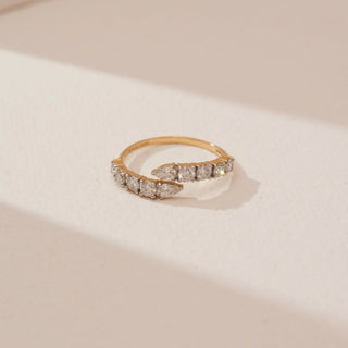 Top view of the Modern Open Diamond Band Ring in 14KT Yellow Gold, featuring pear-shaped diamonds along an open band resembling a contemporary minimalist aesthetic.