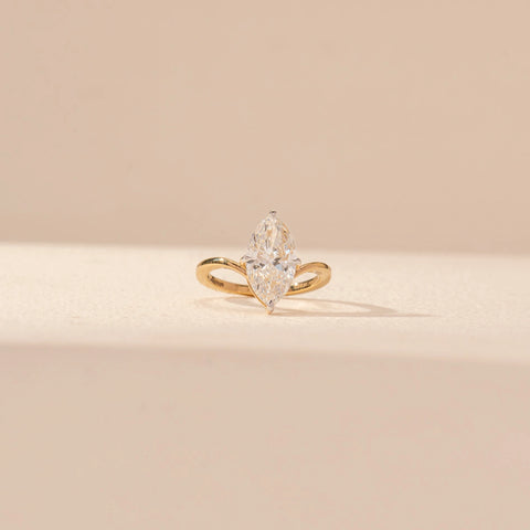 Front view of Marquise Solitaire Diamond Ring in 14KT Yellow Gold, featuring a marquise-cut lab-grown diamond with a curved band.
