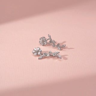Side  view of Floral Vine Drop Diamond Earrings in 14KT White Gold, featuring flower motifs and leaf-shaped diamonds.