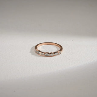 Top view of 14KT Rose Gold Delicate Grace Diamond Eternity Ring with alternating marquise and round EF VVS diamonds, showcasing elegant sparkle in a refined stacking design.