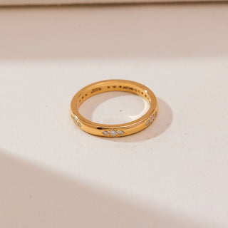 Top view of Celestial Starburst Gold Diamond Band in 14KT yellow gold, featuring round diamonds set in a subtle starburst pattern across a polished solid band.