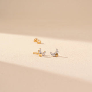 Angled view of Crescent Diamond Earrings in 14KT Yellow Gold, featuring crescent-shaped designs with round lab-grown diamonds.