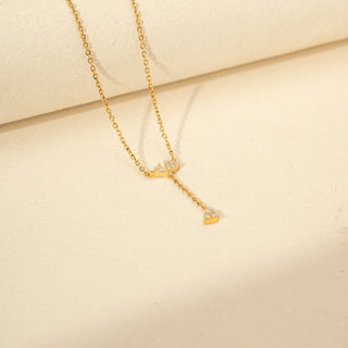 Angled view of Round Solitaire Diamond Ring in 14KT Yellow Gold, featuring a round centre diamond and pavé-set band.