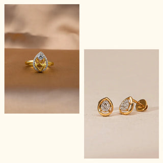 Placed on a warm neutral surface, this Réia lab grown diamond jewellery set features a pear-inspired ring paired with matching stud earrings, highlighted in soft, diffused light.