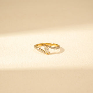 Close-up view of Marquise Solitaire Diamond Ring in 14KT Yellow Gold, featuring a marquise-cut centre diamond and pavé-set curved bands.