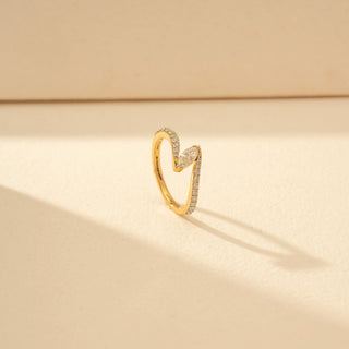 Angled view of Marquise Solitaire Diamond Ring in 14KT Yellow Gold, featuring a marquise-cut centre diamond and pavé-set curved bands.