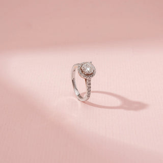 Angled view of Halo Solitaire Diamond Ring in 14KT Dual Gold, featuring a round centre diamond surrounded by a pavé diamond halo.