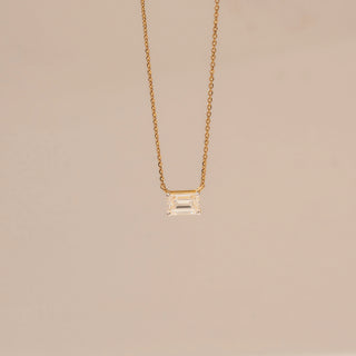 Front view of Emerald-Cut Solitaire Diamond Pendant in 14KT Yellow Gold, featuring a bezel-set lab-grown diamond on a fine chain.