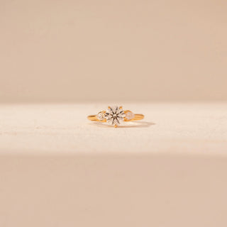 Front view of Floral Solitaire Diamond Ring in 14KT Yellow Gold, featuring a round centre diamond with marquise diamond accents.