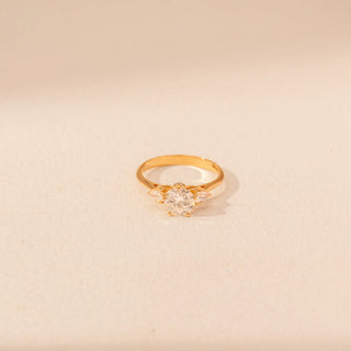 Top view of Floral Solitaire Diamond Ring in 14KT Yellow Gold, featuring a round centre diamond with marquise diamond accents.