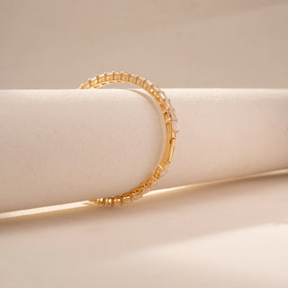 Angled view of Round Solitaire Diamond Ring in 14KT Yellow Gold, featuring a round centre diamond and pavé-set band.