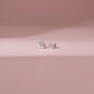 Front view of a 14KT White Gold diamond stud earring, featuring an oval centre diamond and prong setting.