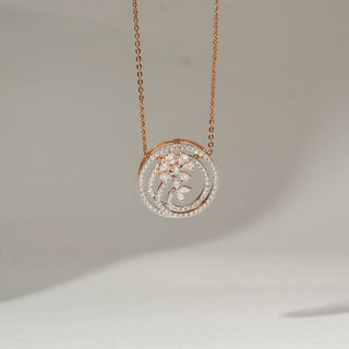 Front view of a rose gold floral pendant necklace featuring diamond-studded circular swirls and marquise-cut diamond flower accents, suspended from a delicate chain on a soft cream background.