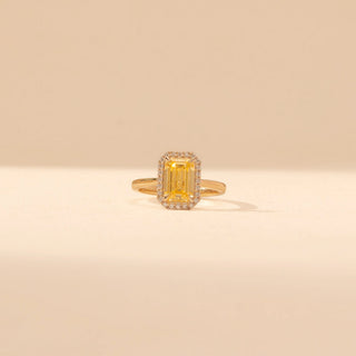 Front view of Emerald-Cut Yellow Diamond Halo Ring in 14KT Yellow Gold, featuring a yellow emerald-cut diamond with a pavé halo.