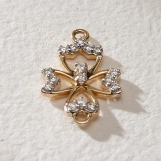 Close-up front of Reia’s Petal Diamond Pendant in 14KT Yellow Gold, adorned with EF VVS diamonds totalling 0.539 carats, crafted in a floral petal motif that radiates elegance and timeless beauty.