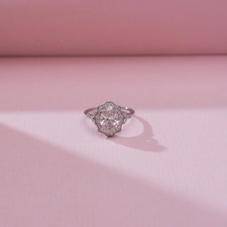 Front view of Oval Scalloped Halo Diamond Ring in 14KT white gold, featuring a large oval centre diamond encircled by a scalloped halo with diamond-accented shoulders.