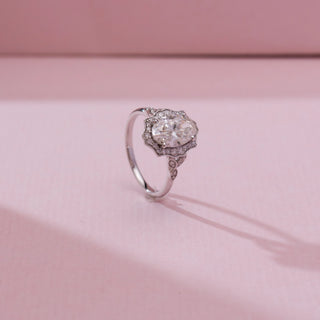 Angled view of Oval Scalloped Halo Diamond Ring in 14KT white gold, featuring an oval centre diamond framed by a scalloped halo and delicate diamond-accented shoulders.